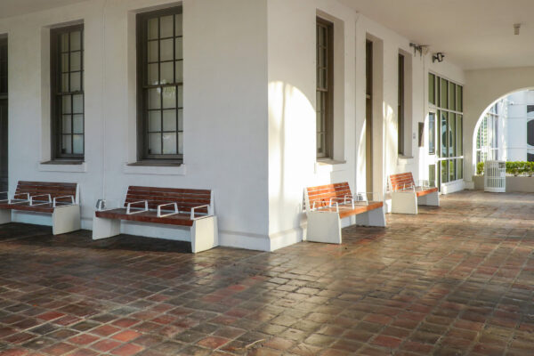 A row of benches in front of a building.