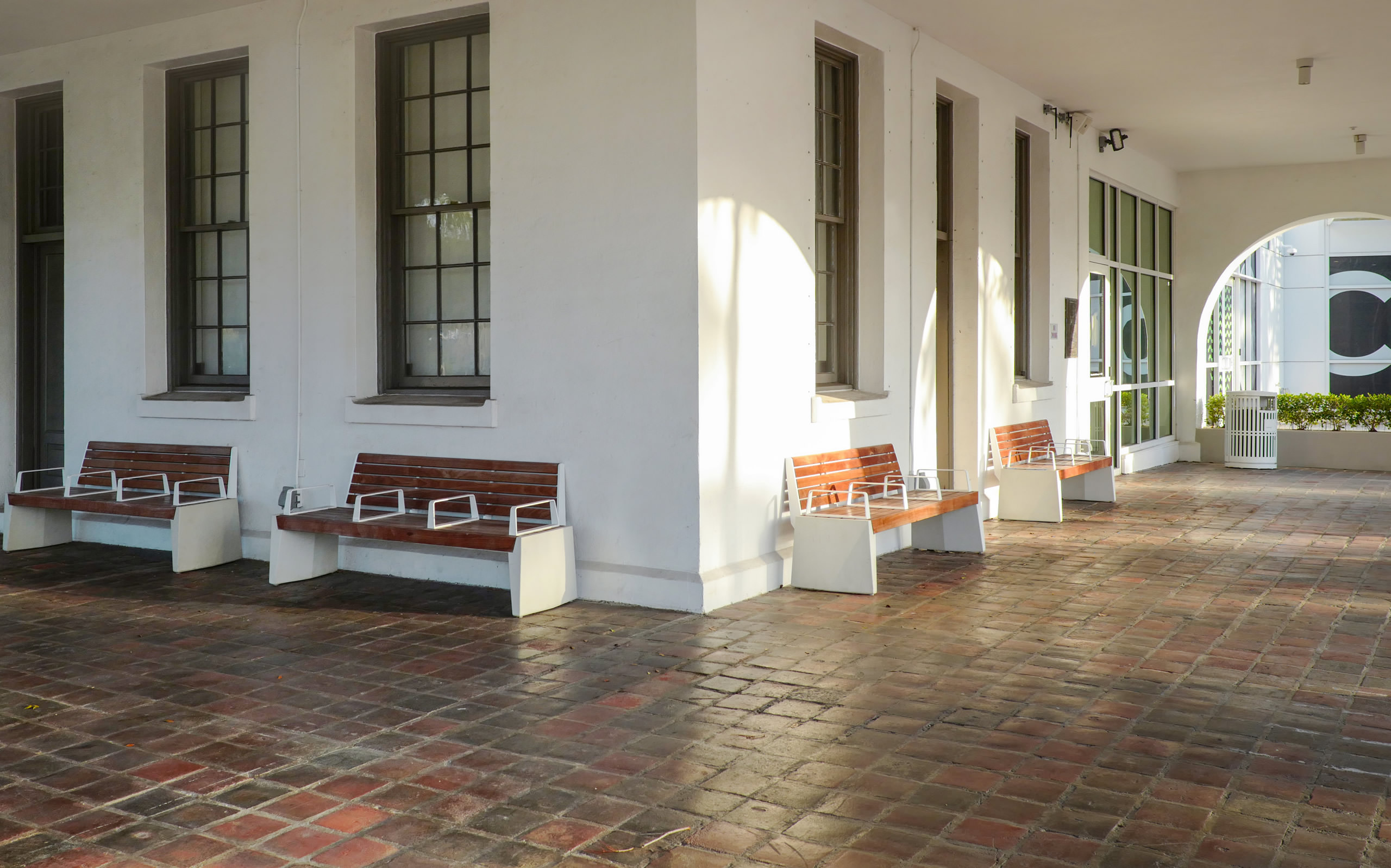 A row of benches in front of a building.