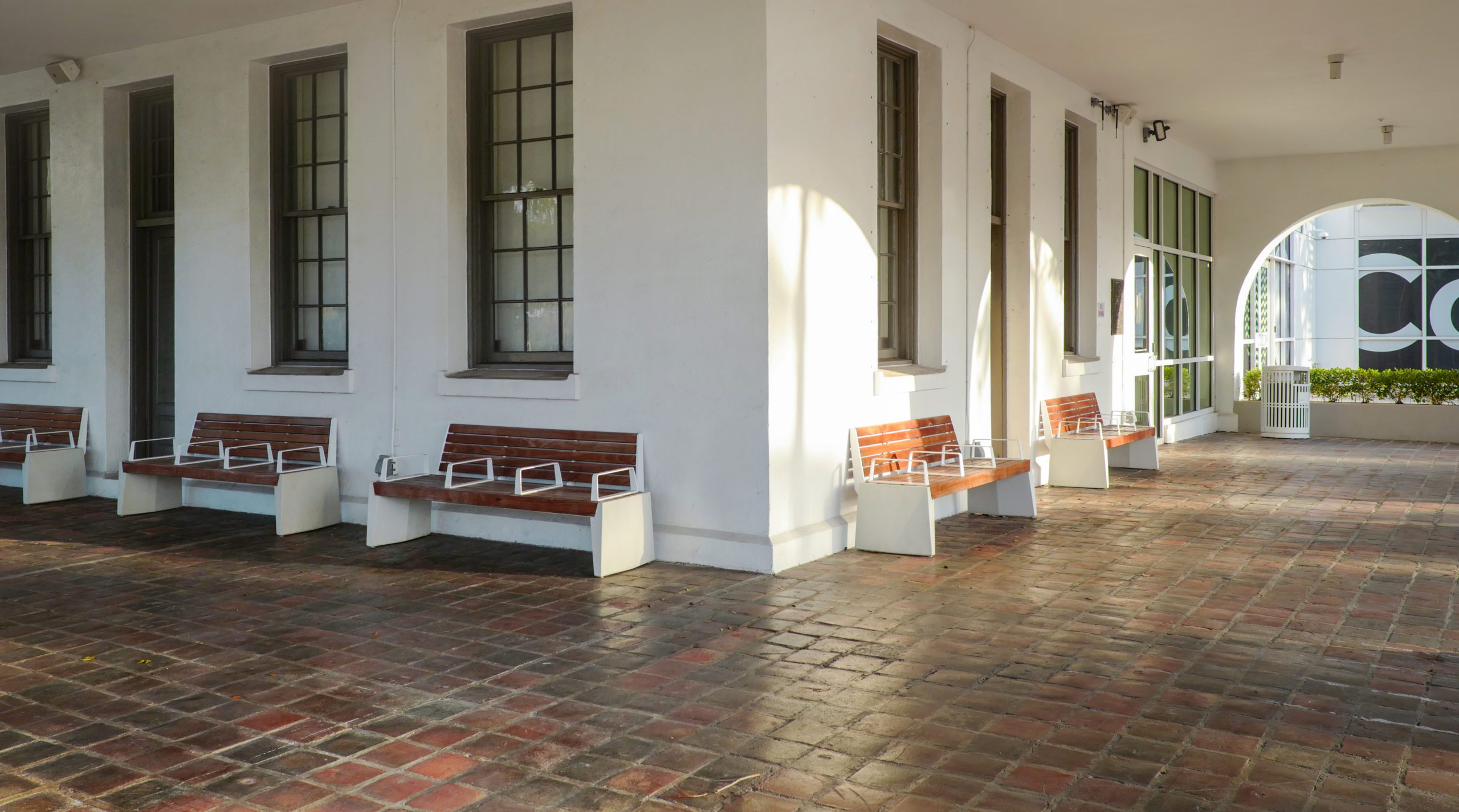 A row of benches in front of a building.